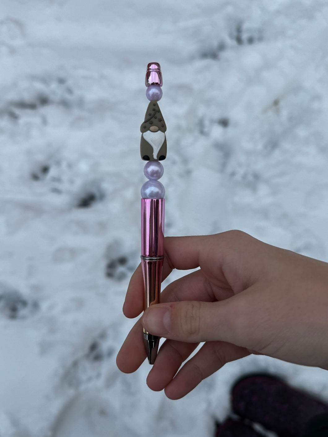 Pink pen with grey gnome