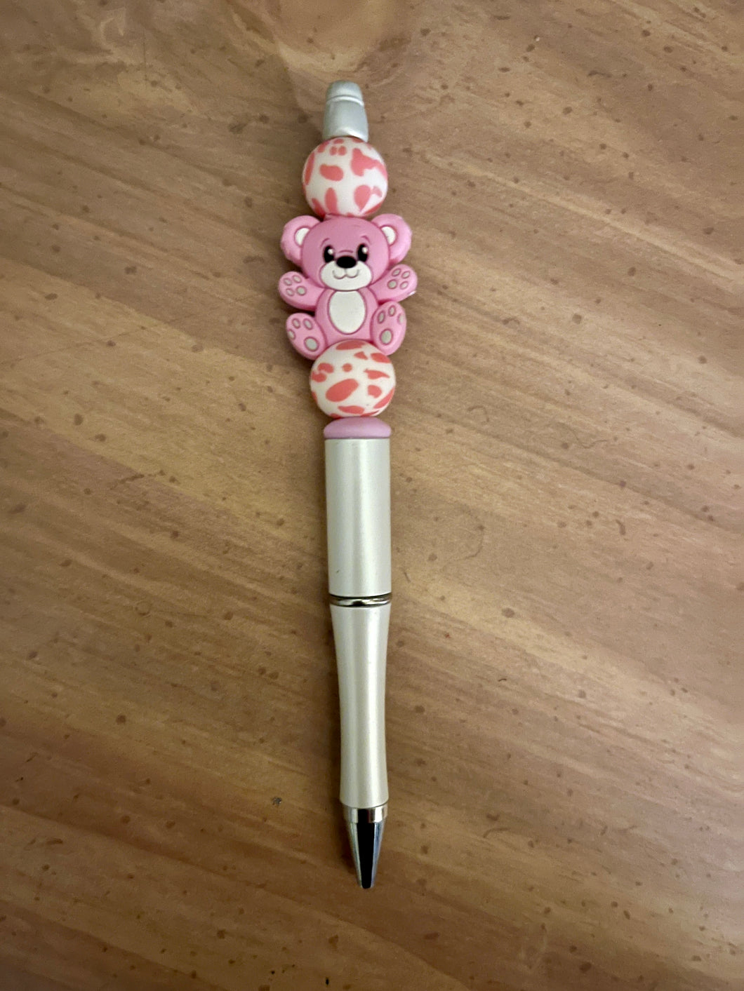 Silver pen with pink bear